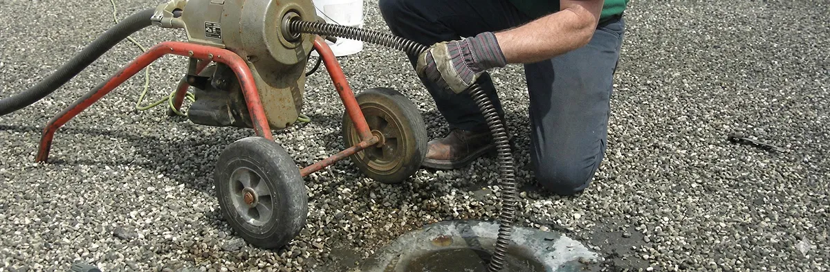 sewer rodding technician actively removing blockages from a sewer line in Scottsdale, AZ